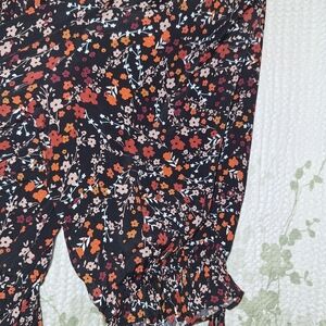 Floral Black Pants with Ruffle Hem